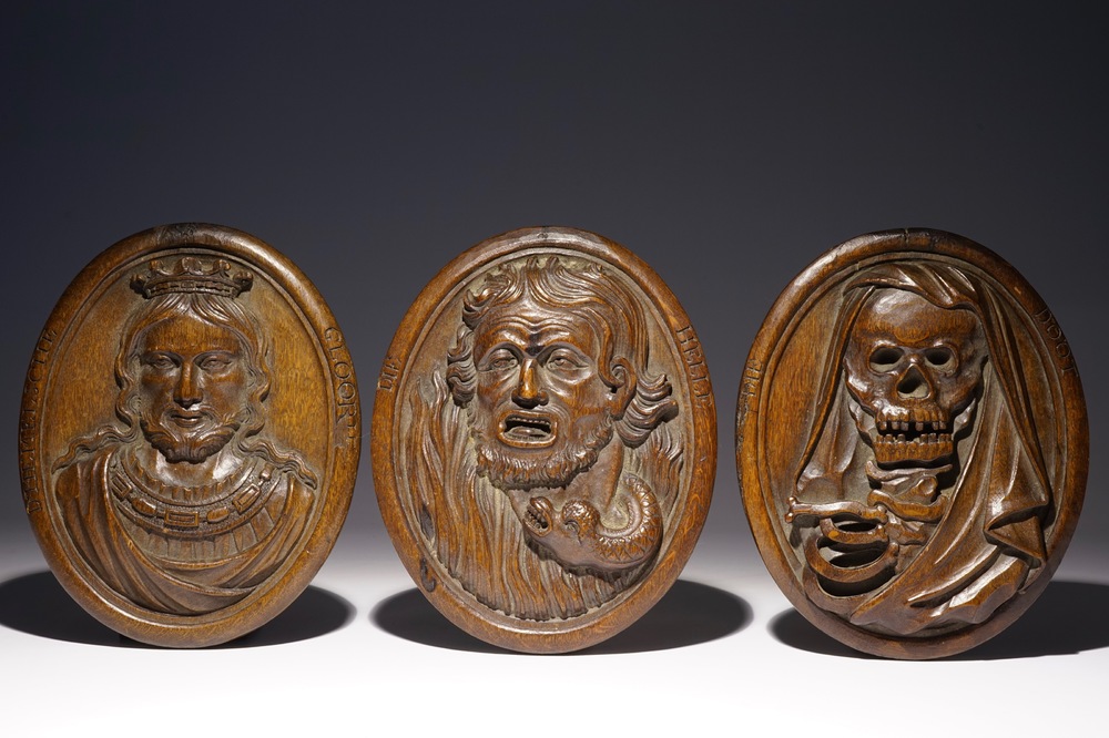 Three Flemish carved wooden medallions with allegorical depictions of "Glory", "Hell" and "Death", 17th C.